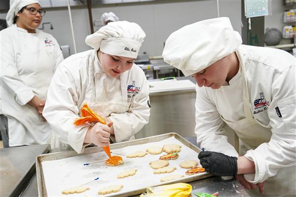 Culinary Arts and Science student working in kitchen 